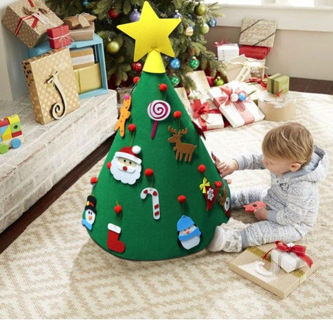 Felt 3D Christmas tree decoration featuring colorful ornaments with a child playing beside it.