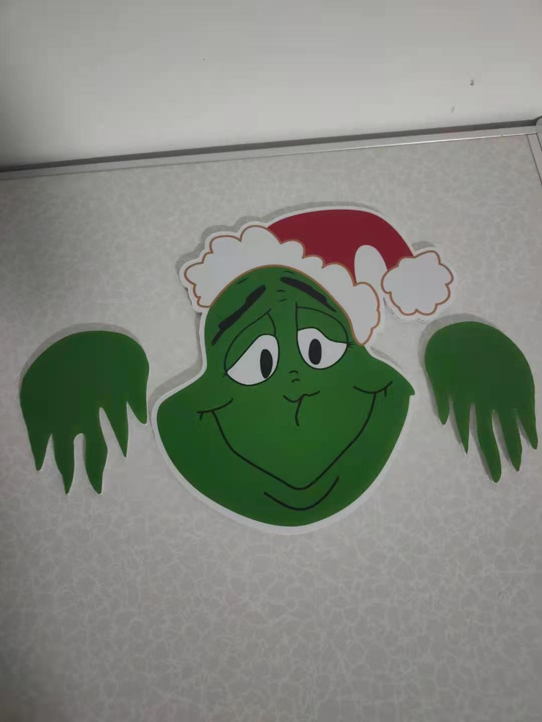 Christmas themed fence garden top decoration Grinch green face LumiqHome